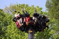 People ride on extreme carousel in a amusement park