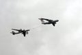 The Il-78 tanker aircraft and the Tu-95MS `Bear` strategic bomber-missile carrier. Simulation of refueling in the air in the sky o Royalty Free Stock Photo