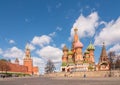 Moscow, Russia - May, 05, 2021: Intercession Cathedral or St. Basil`s Cathedral and the Spassky Tower of Moscow Kremlin at Red Royalty Free Stock Photo