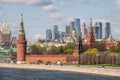 Moscow, Russia - May, 05, 2021: Kremlin Towers and Skyscrapers of Moscow City in spring. The contrast of Moscow architecture with Royalty Free Stock Photo