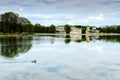 Moscow, RUSSIA-May 11, 2015: Kuskovo park, pond and Kuskovo palace. Kuskovo was the estate of the Sheremetev family. Royalty Free Stock Photo