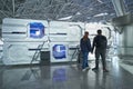 Moscow, Russia - may 1 2019: Man and woman tourists looking at capsule hotel at Vnukovo airport