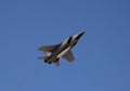 The modernized fighter-interceptor MiG-31 with hypersonic missiles `Dagger` flying in the sky over red square.