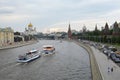 Moscow, Russia - May 28, 2021: Moscow river overlooking the Kremlin, river catamaran with tourists traveling around the Russian