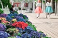 Moscow, Russia - May, 05, 19. Music bench, beautiful flowers and pink,green, white ribbons fluttering in the wind on