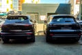 Moscow, Russia - May 18, 2019: New and old generation of Porsche Cayenne in gray-blue color parked on the street. Back side, Royalty Free Stock Photo