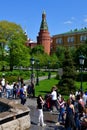 Moscow, Russia - May 12. 2018. People in Alexander Garden on background of Corner Arsenal Tower