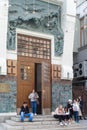 People sit on the steps near the Small Stage of the Art Theater