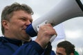 Politician Sergey Mitrokhin he speaks into a megaphone at the rally of the Yabloko party in defense of free access to