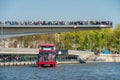 Moscow, A river tram takes place on the Moscow River under the Soaring Bridge in Zaryadye Park