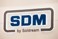 SDM Soldream logo sign banner. SDM is the leading supplier of high-level metalworking equipment