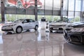 Selling cars Toyota in the showroom. New products automaker Toyota