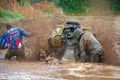 ATV is stuck and splashes mud