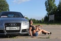 Moscow. Russia - May 20, 2019: Silver Audi A6 S line is parked on outdoor. Near sits the girl is the owner of the car in black t