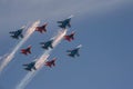 Aerobatic teams `Strizhi` and `Russian Knights` on the planes `Su-30 SM` and `MiG-29` produce a salute in the sky.