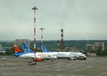 Sukhoi Superjet 100-95 by Azimut and Boeings of Pobeda lowcoaster in Vnukovo international airport on the aero field Royalty Free Stock Photo