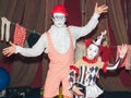 clown man on roller skates with his little assistant girl of his stage persona. Royalty Free Stock Photo