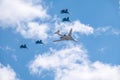 Moscow, Russia - May, 05, 2021: The Tu-160 strategic missile carrier, accompanied by four Su-35S fighter jets, flies over Red Royalty Free Stock Photo