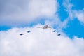 Moscow, Russia - May, 05, 2021: The Tu-160 strategic missile carrier, accompanied by four Su-35S fighter jets, flies over Red Royalty Free Stock Photo