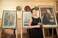 MOSCOW, RUSSIA, MAY 19, 2014: Unidentified teenager girl graduating the art school with his diploma painting works, May 19, 2014.