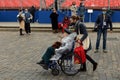 Victory Volunteers help a veteran of the Great Patriotic War on Moscow`s Red Square during the Victory Day celebration