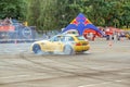 Moscow, Russia - May 25, 2019: Yellow Drift bmw hatchback. Tuned car drifting in the fenced area