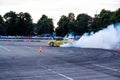 Moscow, Russia - May 25, 2019: Yellow Drift Nissan Silvia. Tuned car drift in the fenced area. Make burnout with a lot of smoke