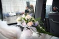 RUSSIA - MAY 20, 2006: Young women take pictures from window with rain drops during the wedding
