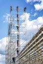 Moscow, Russia, 08/06/2019: Men on high scaffolding Royalty Free Stock Photo
