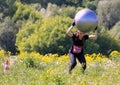 Moscow festival of fitness. A woman jumping with a ball.