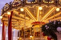 Moscow, Russia, 01/01/2020: New Year`s festive carousel with people rolling and having fun. Close-up Royalty Free Stock Photo