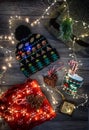 Christmas decor, christmas hat and cup with lollipops, garland of lights