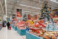 Christmas supermarket. Sale of festive Christmas accessories and trees in a retail store. Royalty Free Stock Photo