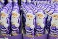 Moscow, Russia, November 2020: Close up of lots of chocolate winking Santa Claus Milka in purple