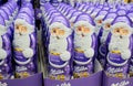 Moscow, Russia, November 2020: Close up of lots of chocolate winking Santa Claus Milka in purple