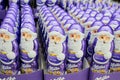 Moscow, Russia, November 2020: Close up of lots of chocolate winking Santa Claus Milka in purple