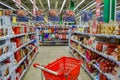 Moscow, Russia, November 2019: Colorful gift bags, rows of Christmas sweets for children: chocolate figurines, boxes of sweets and