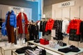 Moscow, Russia, November 2020: Corner of the Hugo Boss brand. Women`s fashion. Luxury brand. Mannequins are dressed in winter