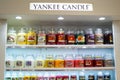 Moscow, Russia, November 2020: Corner of the Yankee candle brand. Showcase with a variety of scented candles in glass jars