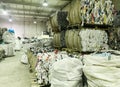 A huge storage for the collection of recyclables. Materials for processing are bound in huge bales