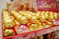 Lindt chocolate Teddy bears in gold foil and with a red heart pendant are sold in a supermarket
