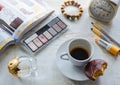 Moscow, Russia,November 2019: Morning routine: unfinished coffee with a piece of chocolate chip cookies, perfume, cosmetics,