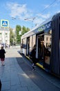 Moscow, Russia - November 2020 Photography of people at the the tram stop. People come in and out of streetcars They