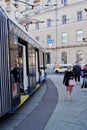 Moscow, Russia - November 2020 Photography of people at the the tram stop. People come in and out of streetcars They