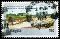 Postage stamp printed in Malaysia shows Preparation of a tin mine, World Tin Conference serie, 15 Malaysian sen, circa 1974