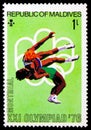 Postage stamp printed on Maldives shows Wrestling, Summer Olympic Games 1976 - Montreal serie, circa 1976