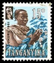 Postage stamp printed in Tanganyika shows Coffee Picker, Independence Day serie, 15 East African cent, circa 1961