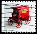 Postage stamp printed in United States shows Toy Mail Wagon - First Class,  serie, circa 2002 Royalty Free Stock Photo