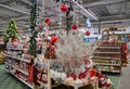 Moscow, Russia, November 2019: Sale of Christmas decorations in the store: balls, gold, red baubles, figurines of nutcrackers,