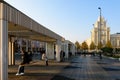 Moscow, Russia - Oct 19, 2018: Triumphal square with swing. One of Moscow`s famous Stalinist skyscrapers in background